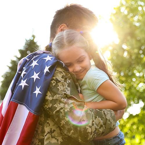 Father in military uniform with American flag | Jabara's