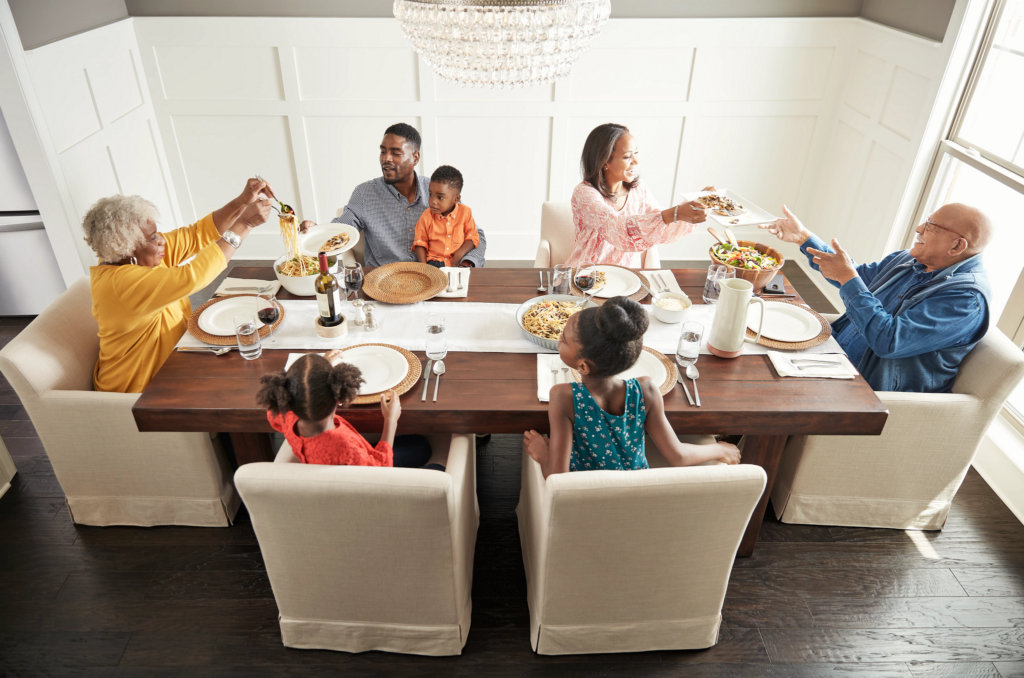 Family enjoying food in dining room | Jabara's